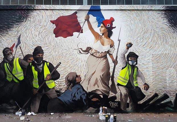 Imagem da matéria: Artista de rua esconde mil dólares em Bitcoin dentro de mural sobre protestos em Paris