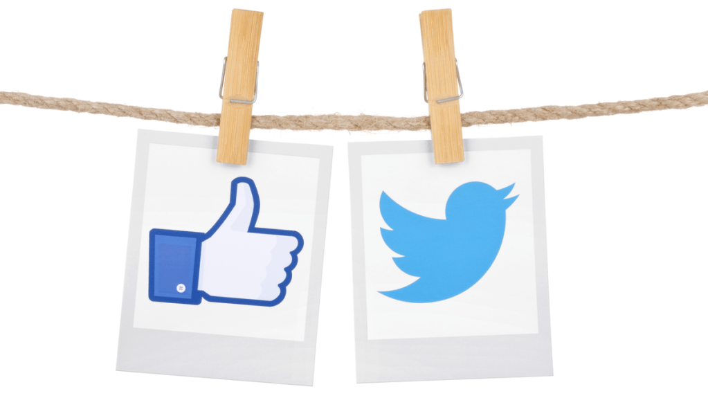 Figuras de um joinha e do logo do Twitter penduradas em um varal lado a lado