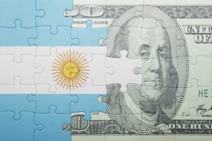 Imagem da matéria: Argentina proíbe compra de dólares para quem adquiriu criptomoedas nos últimos três meses