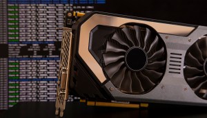 mineradora de bitcoin à frente de um tela que mostra hashrate de bitcoin