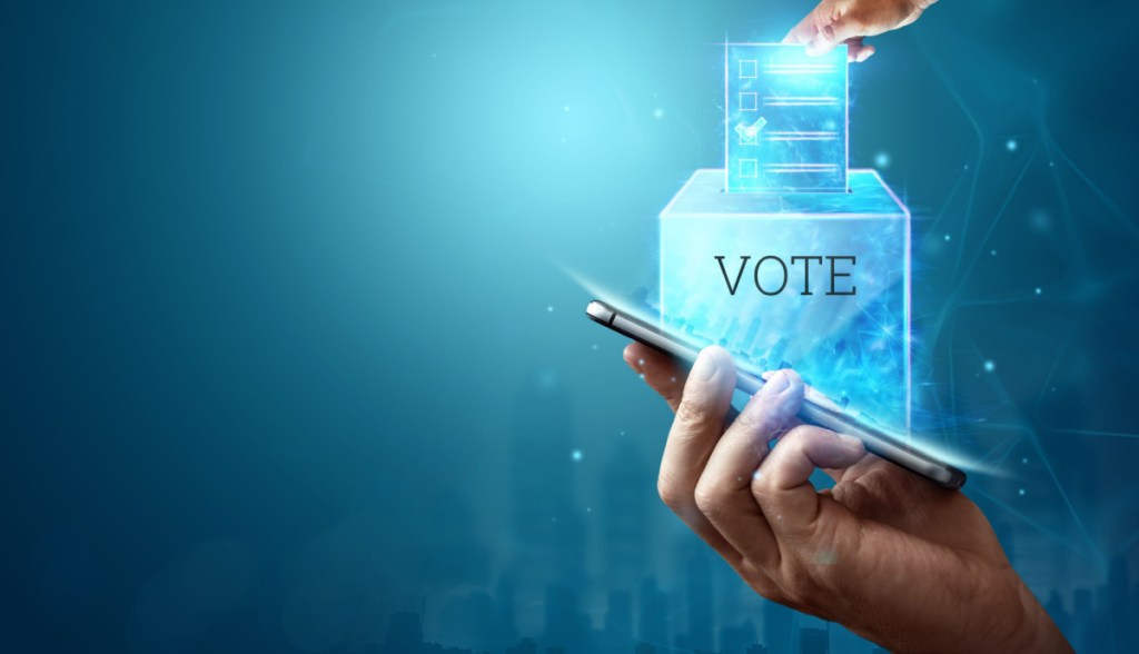 Imagem de um voto digital sendo depositado em um celular
