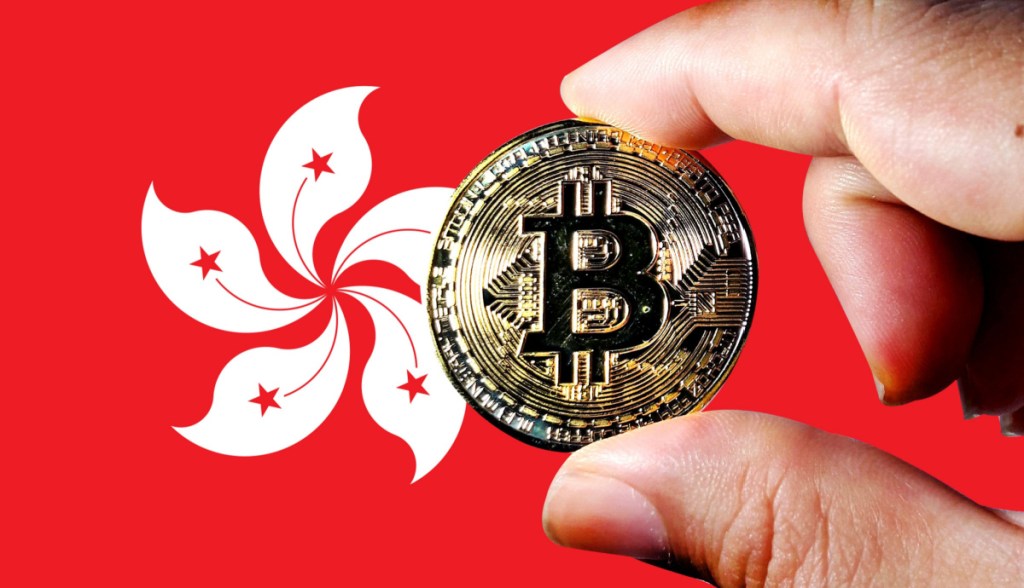 moeda de bitcoin à frente da bandeira de hong kong